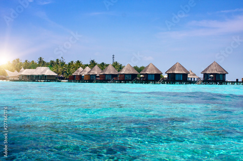 Fototapeta Naklejka Na Ścianę i Meble -  houses over transparent quiet sea water- tropical paradise, Maldives