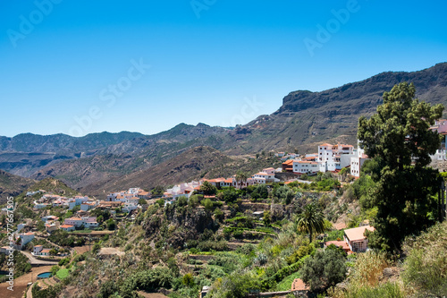 lanscape view of small spanish town of Tejeda in gran canaria island on mountain valley on summer day with clear blue sky