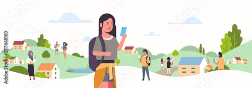 young girl using smartphone social network communication concept mix race people chatting online mobile messaging application countryside landscape background portrait flat horizontal