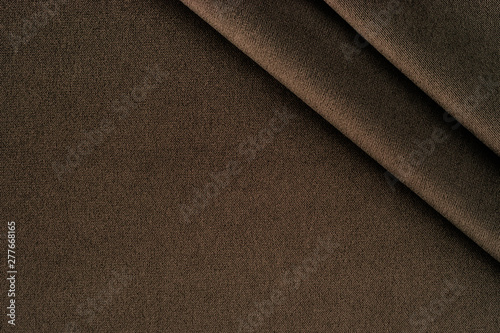 Texture of dark brown fabric close up. 