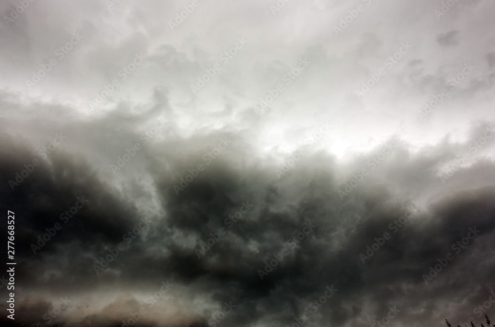 Obraz premium Dark and Dramatic Storm Clouds Area Background