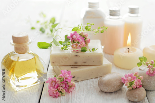 spa still life with essential oil, soap bars and aromatherapy candles