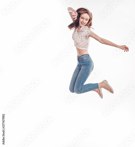 portrait of happy emotional girl in jeans .