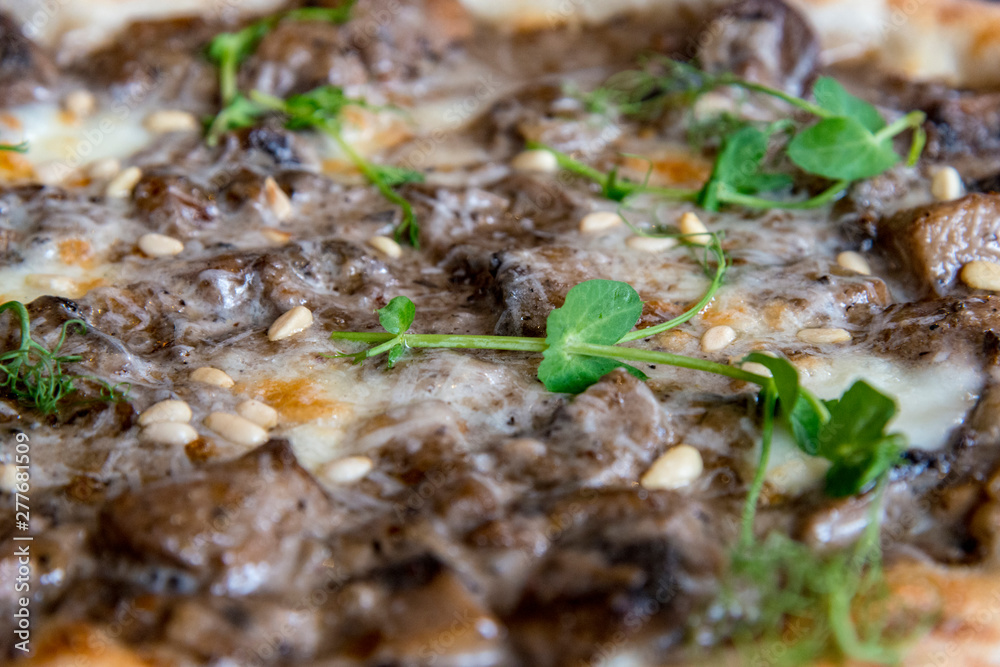 Pizza with mushrooms, cheese and pine nuts Pizza with mushrooms, cheese and pine nuts