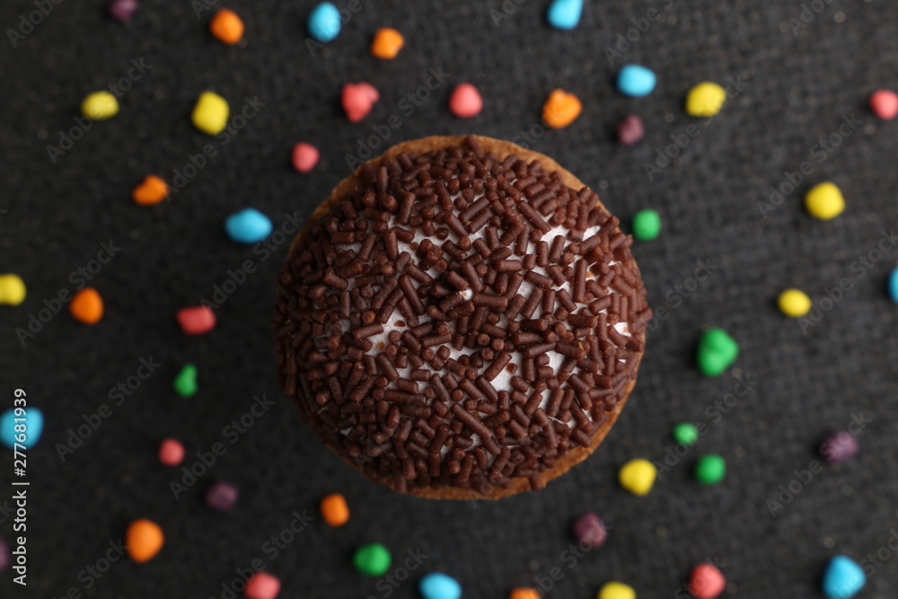 Chocolate Crinkle cookies. close-up of Crinkle cookies chocolate biscuits on Christmas cookies on a black plate, view from above. Chocolate Crinkle cookies. close-up of Crinkle cookies chocolate biscuits on Christmas cookies on a black plate, view from above.