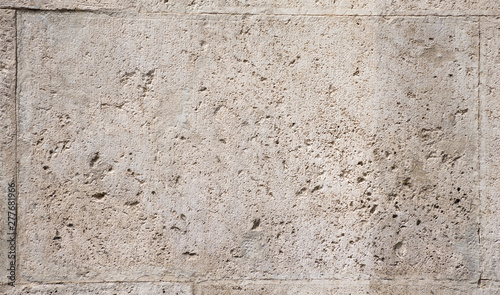 Fotografia Background of fragment of old Roman stone wall