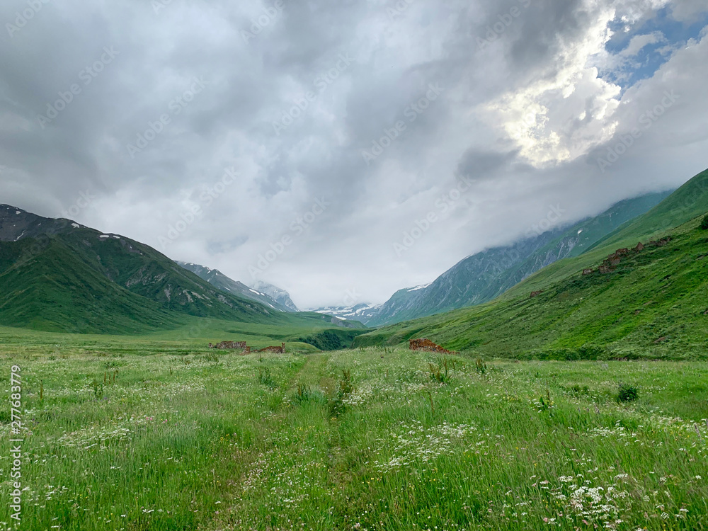 Fototapeta premium Russia, North Ossetia. Mountains forming the Zrug gorge in cloudy weather