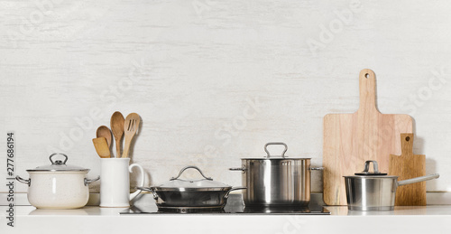 Kitchen utensils and stainless steel cookware photo