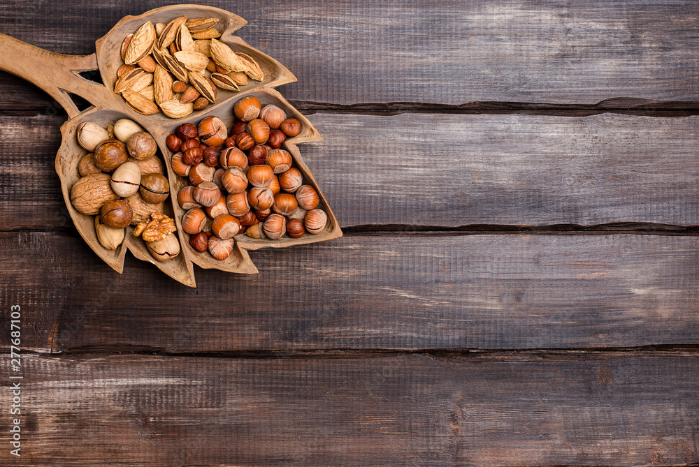 Various nuts in wooden background Various nuts in wooden background
