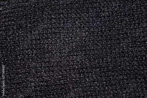 Dark fabric knitted texture is macro