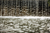 artificial city waterfall with water splashes