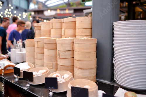 Bamboo steamer - container of bun , dim sum , steamed dumpling photo