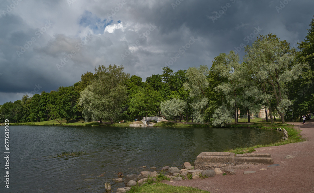 Fototapeta premium Storm clouds over the park in summer. Gatchina. Russia