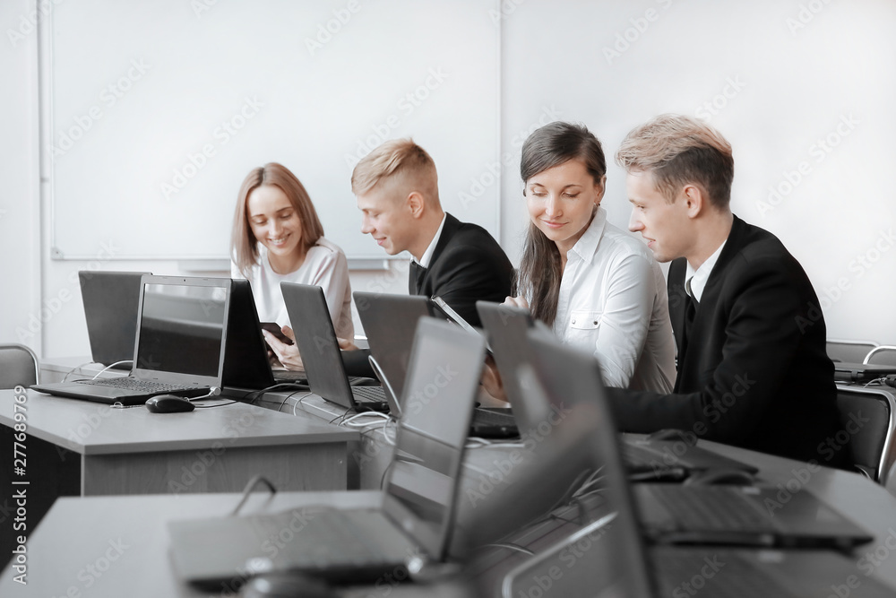 group of Programmers working in the office of the software developer. group of Programmers working in the office of the software developer.