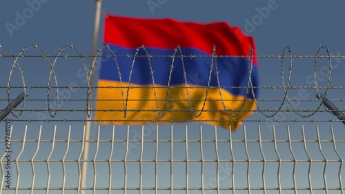 Many waving flag of Armenia behind barbed wire fence. Conceptual loopable 3D animation photo