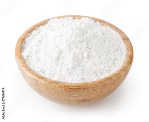 White wheat flour in wooden bowl isolated on white background with clipping path