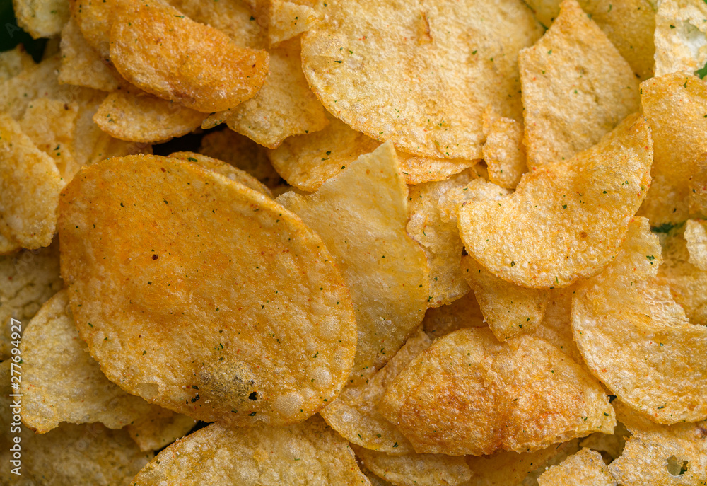 Natural looking fresh potato chips. Macro with shallow depth of field. Natural looking fresh potato chips. Macro with shallow depth of field.