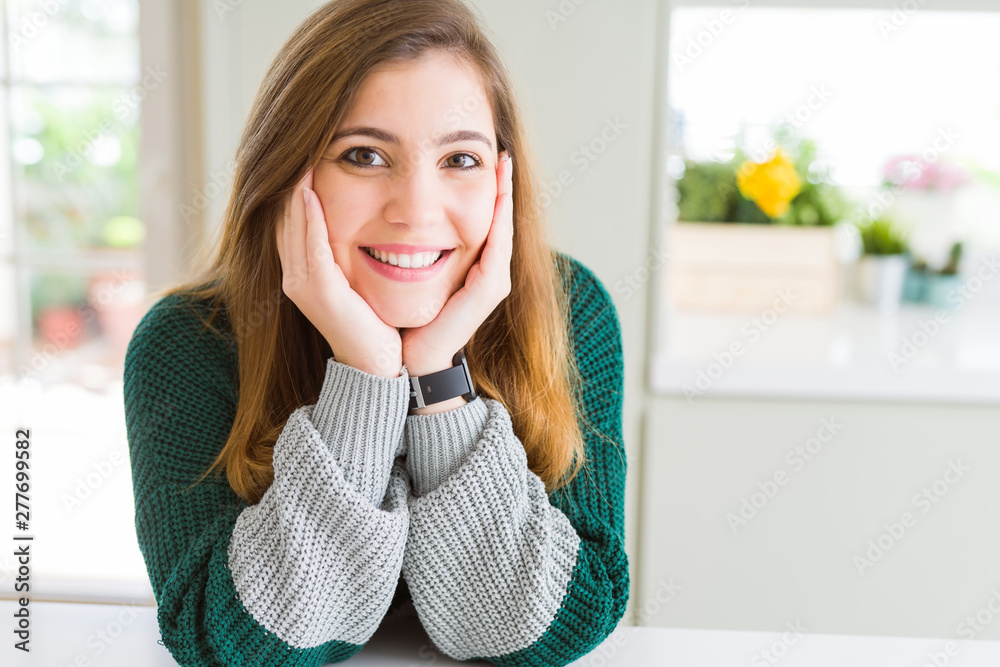 Beautiful young woman smiling confident to the camera Beautiful young woman smiling confident to the camera