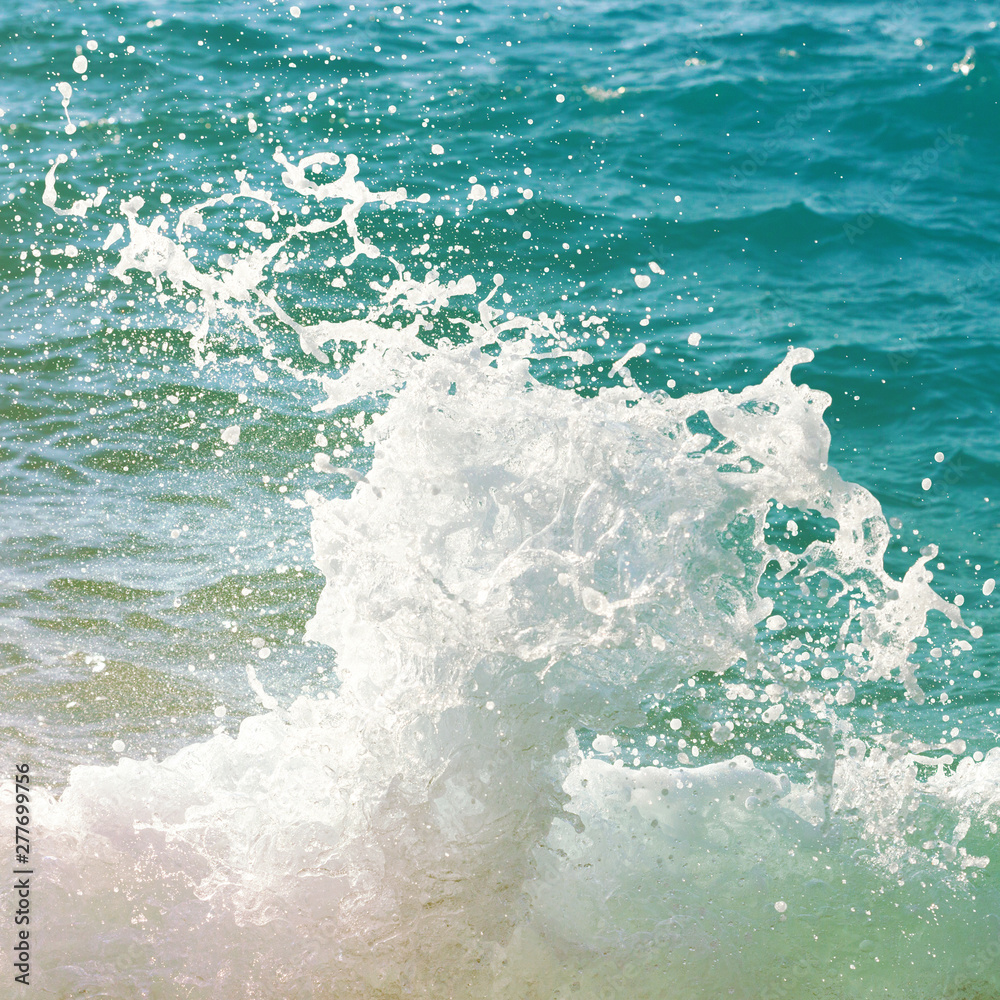 Splash of sea wave. Beautiful aquamarine water.