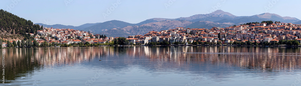 Panorama of a mountain lake and the city