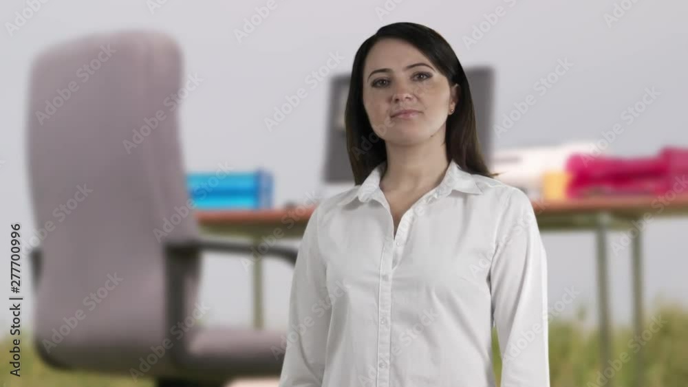 Woman against freelance or remote work business concept background chroma key sequence. Confident woman looking at camera standing against green meadow office workplace / green screen. Woman against freelance or remote work business concept background chroma key sequence. Confident woman looking at camera standing against green meadow office workplace / green screen.