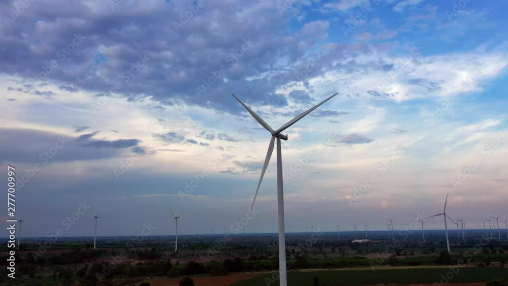 Aerial view of wind turbines on the field. Production of clean energy without pollution for the environment. Cleaner Power generation. 4K Resolution Aerial view of wind turbines on the field. Production of clean energy without pollution for the environment. Cleaner Power generation. 4K Resolution