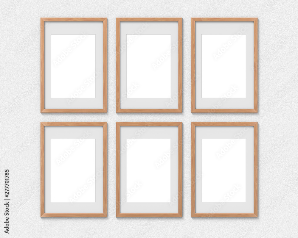 Set of 6 vertical wooden frames mockup with a border hanging on the wall. Empty base for picture or text. 3D rendering. Set of 6 vertical wooden frames mockup with a border hanging on the wall. Empty base for picture or text. 3D rendering.