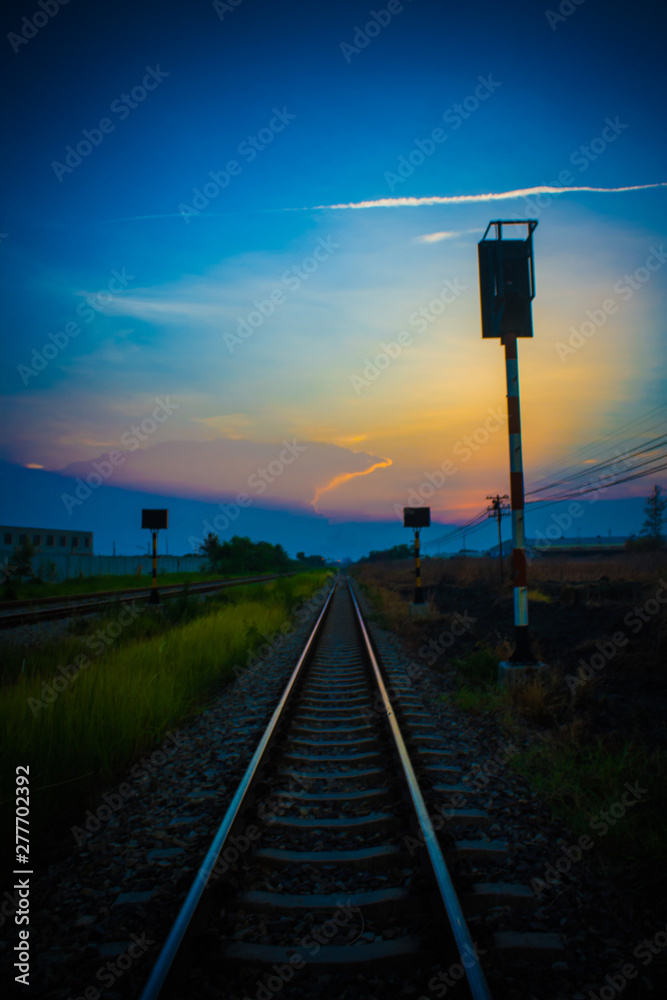 The evening sun shines on the beautiful railway.