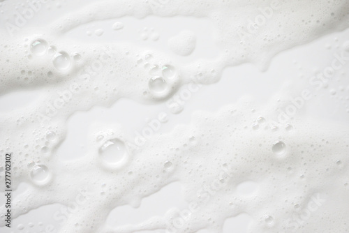 Abstract background white soapy foam texture. Shampoo foam with bubbles