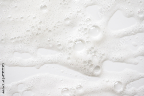 Abstract background white soapy foam texture. Shampoo foam with bubbles