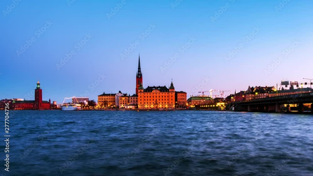 Stockholm, Sweden. Time-lapse of Gamla Stan in Stockholm, Sweden with landmarks like Riddarholm Church during the sunrise. View of old buildings and cloudy sky in morning, zoom in Stockholm, Sweden. Time-lapse of Gamla Stan in Stockholm, Sweden with landmarks like Riddarholm Church during the sunrise. View of old buildings and cloudy sky in morning, zoom in