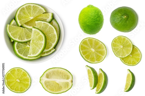 Set of fresh whole and slices lime. Isolated on white background. Top view