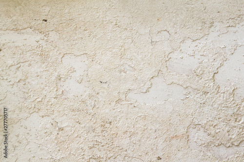 Old distressed gypsum plaster whitewashed wall background or texture