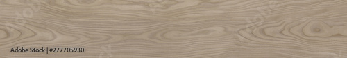 Wooden wavy striped texture. Seamless pattern. The texture of wood for a pattern of packaging in a modern style. Beautiful drawing with the divorces and wavy lines in beige tones for wallpapers