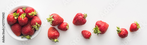 panoramic shot of fresh and ripe strawberries on white bowl