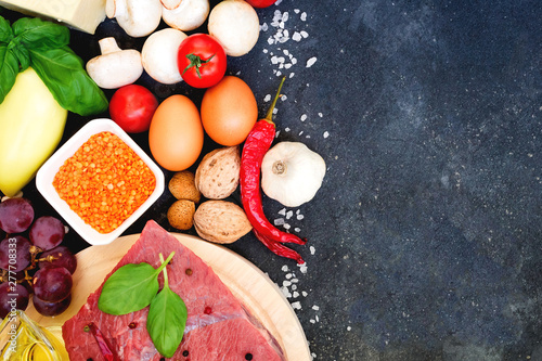 Healthy nutrition concept. Balanced healthy organic diet food. Fresh vegetables, fruit, beans, meat, fish, dairy products. Space for text. Top view. Cooking ingredients.  Clear eating. Copy space.