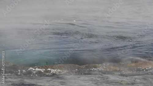 Video showing water boiling up to an eruption at Geysir geyser in Iceland at Haukadalur valley on the slopes of Laugarfjall hill photo