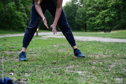 Sporty girl getting ready for an intensive outdoor workout 