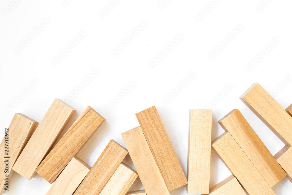 wooden blocks of the game lie on a white background below the frame with free space on top
