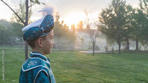 circumcision boy dressed in traditional clothing