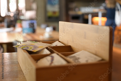 Wooden box with authentic teabags in a cultural cafe