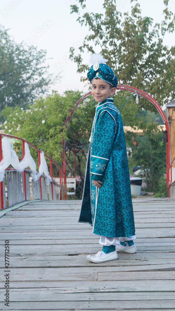 Fototapeta premium circumcision boy dressed in traditional clothing