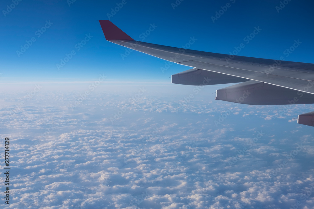 View from a plane window above the cloud. View from a plane window above the cloud.