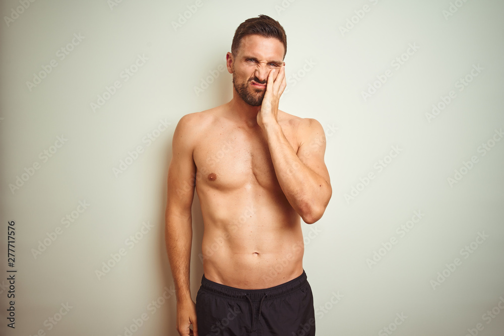 Fototapeta premium Young handsome shirtless man over isolated background thinking looking tired and bored with depression problems with crossed arms.