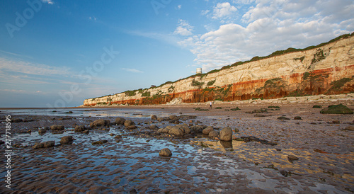 The famous red and white chalk cliffs of Hunstanton in Norfolk, England. photo