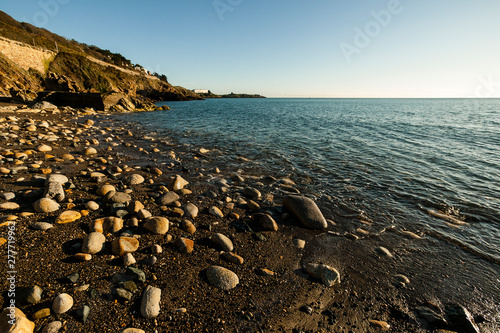 Canvas Print Rocks and sand on the beach near Killiney, Dublin
