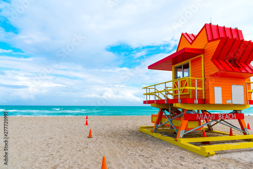 Colorful lifeguard hut under a cloudy sky in Miami Beach © Gabriele Maltinti