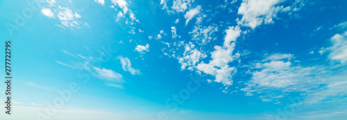 Small clouds and blue sea in summertime
