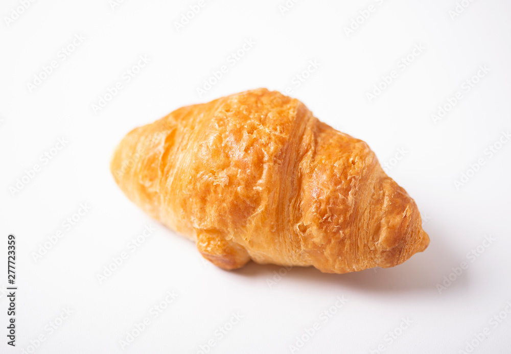 Close-up of croissant on white background. Isolated. Close-up of croissant on white background. Isolated.
