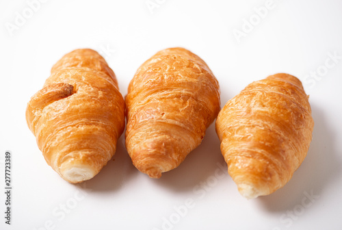 Close-up of three croissants on white background. Isolated.